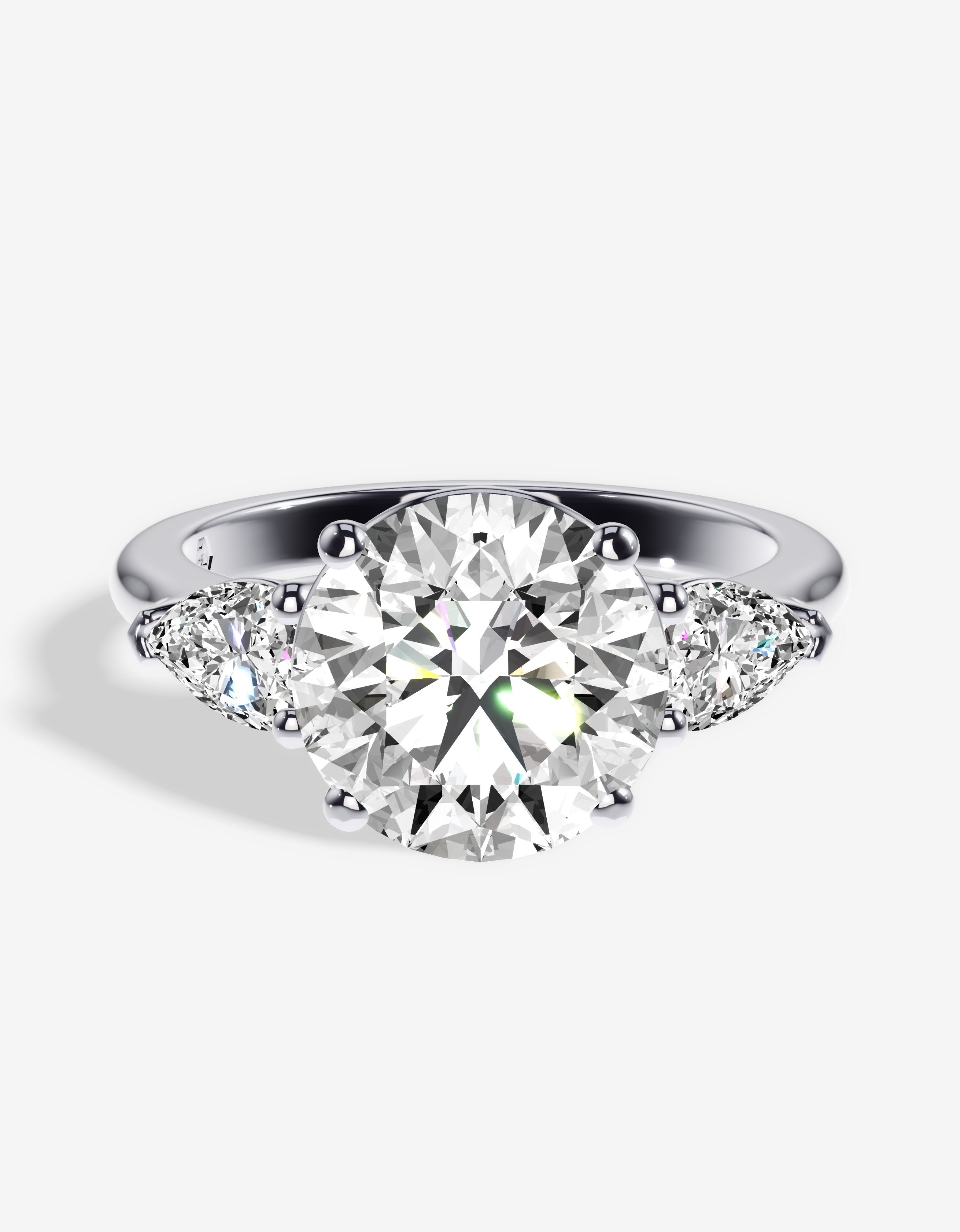 The Nia Three Stone Diamond Engagement Ring With Side Pear Diamonds ...